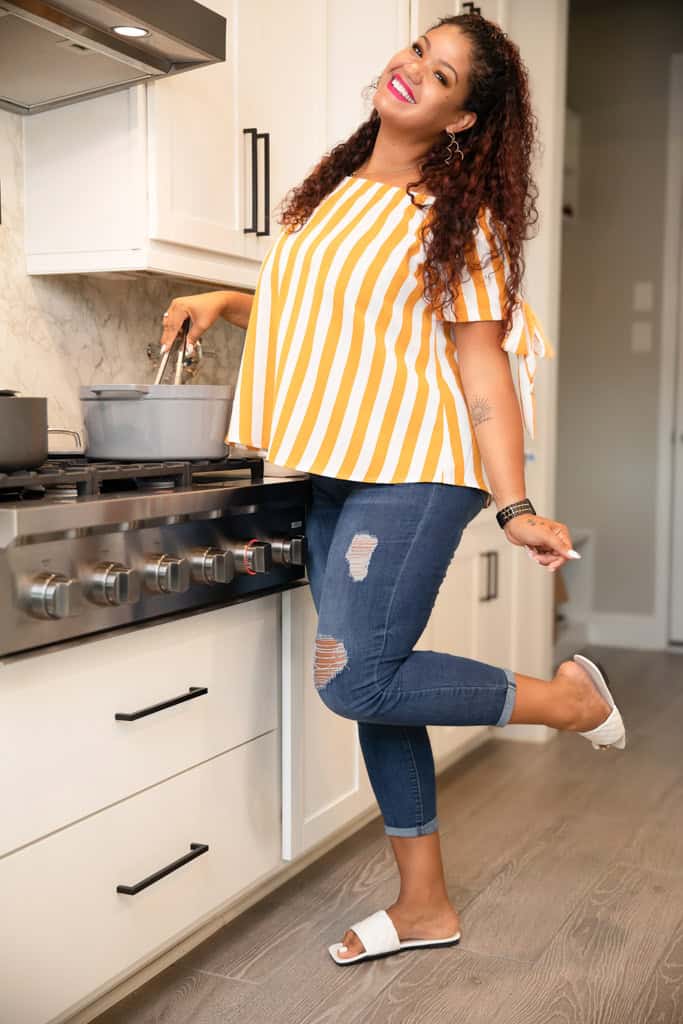 Tamara Johnson cooking a pot of greens in the kithcen