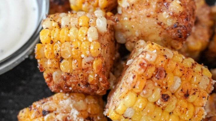 plated fried corn on the cob with a side of ranch dressing