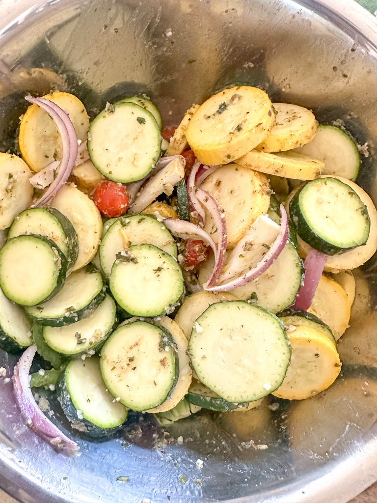 seasoning vegetables in a bowl