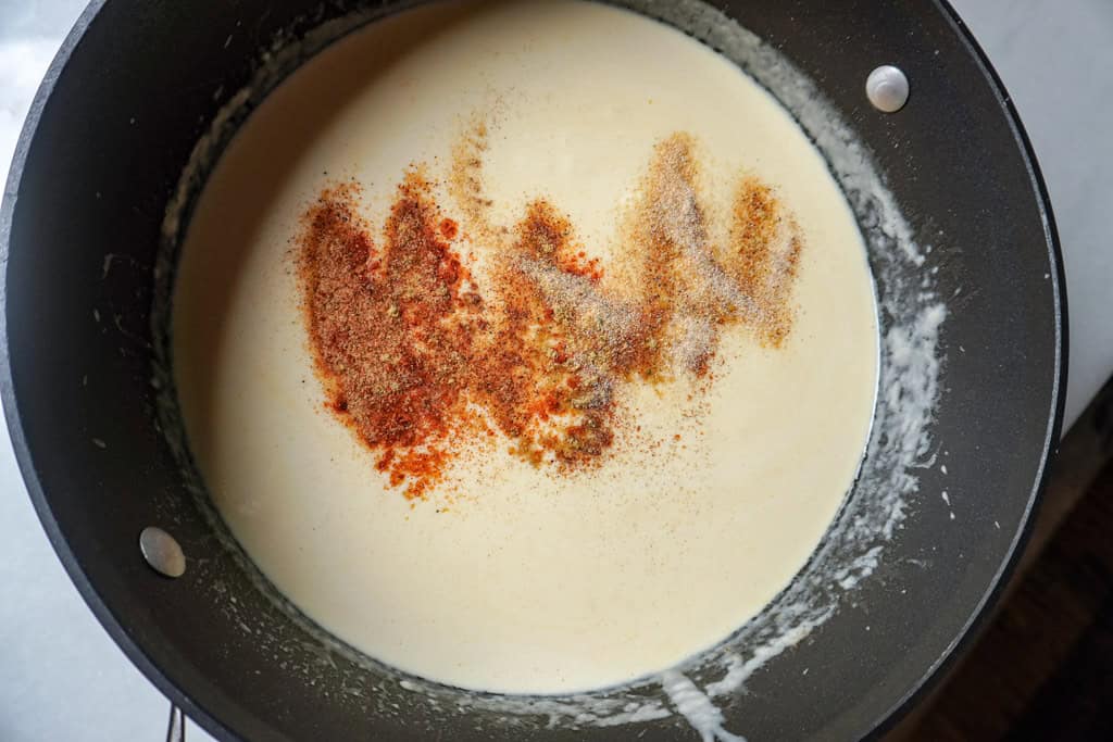 cheese sauce in a skillet for lobster mac and cheese