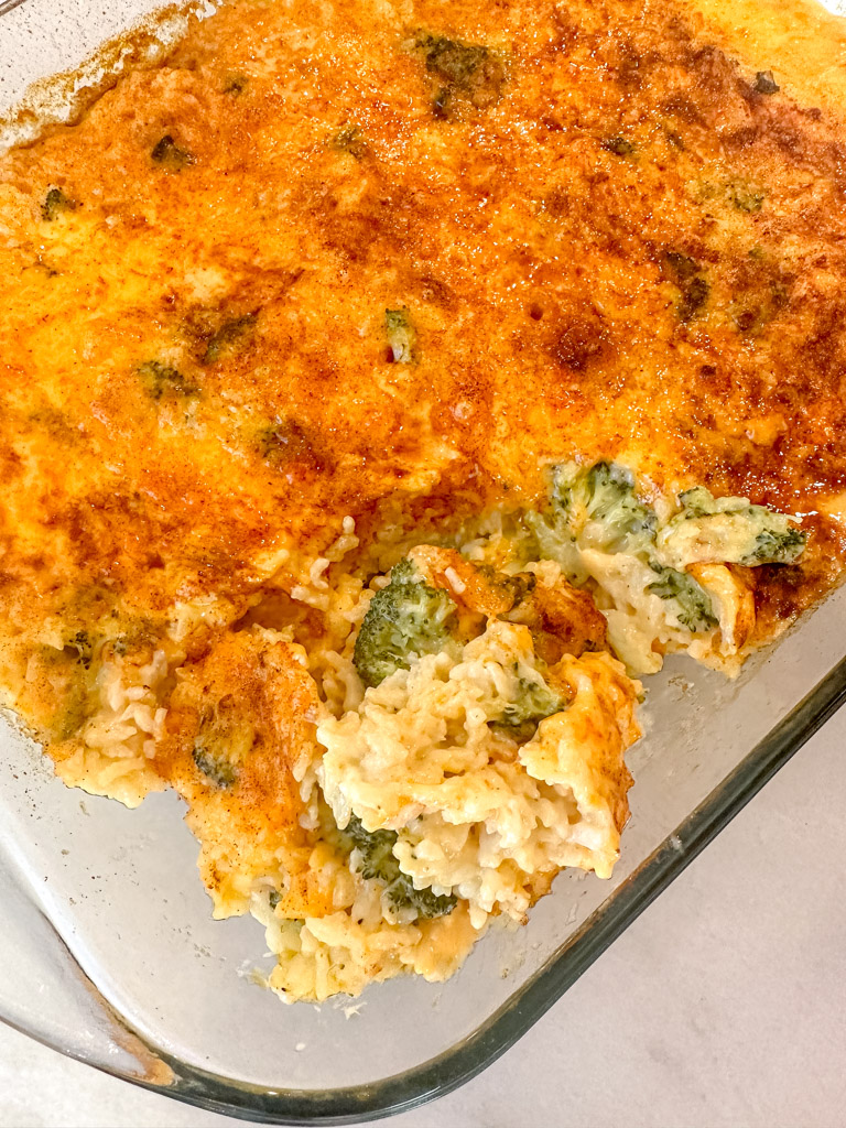 pan full of broccoli rice casserole with the center revealed
