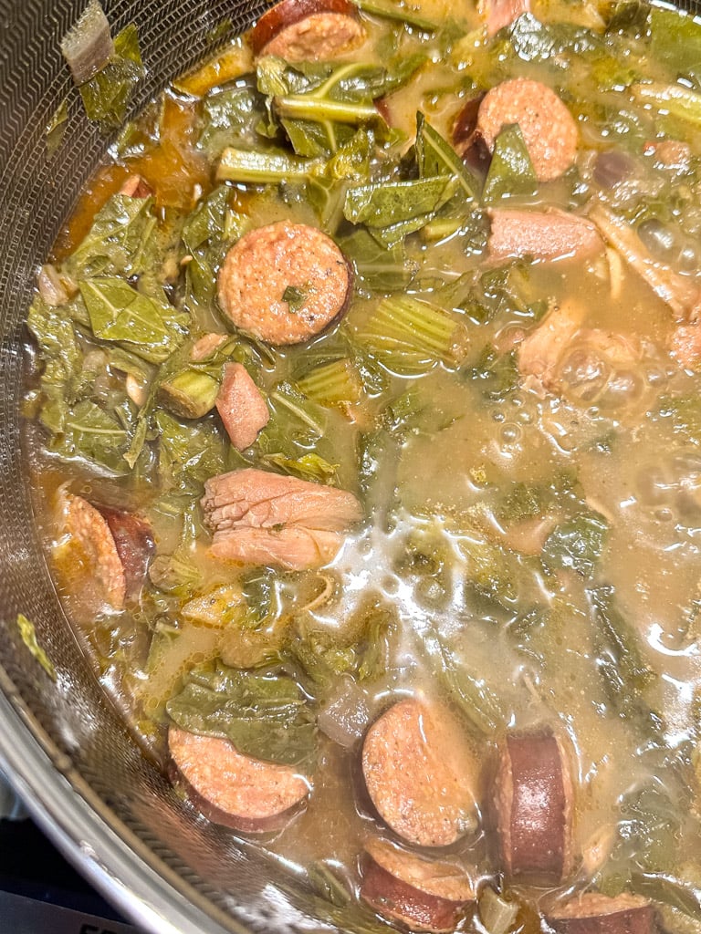 close up view of green gumbo in stock pot