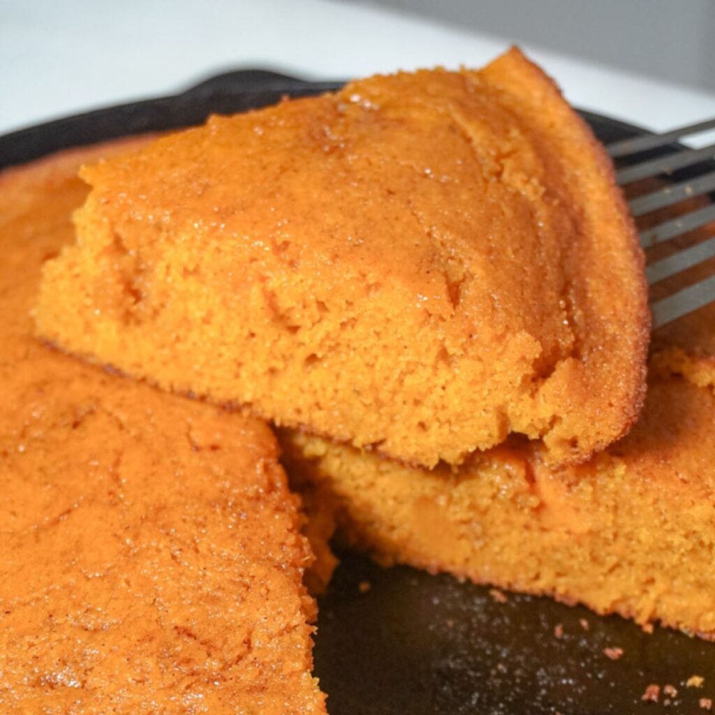close up view of a slice of sweet potato cornbread
