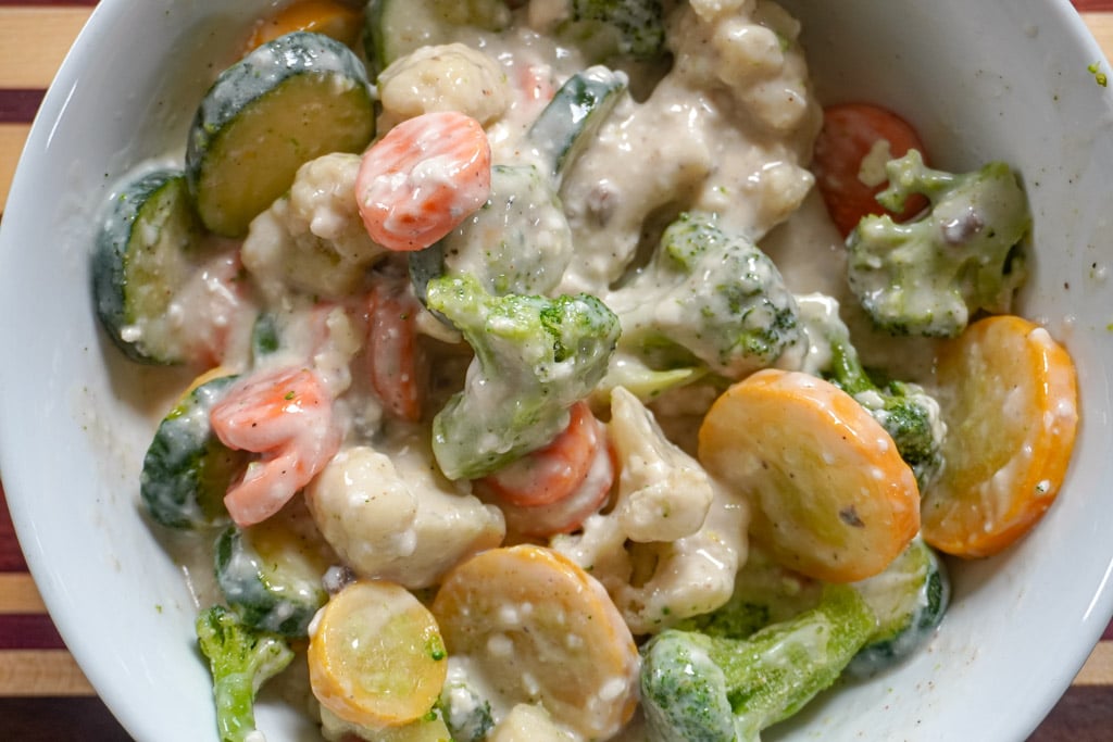 close up view of creamy mixed vegetables in a bowl