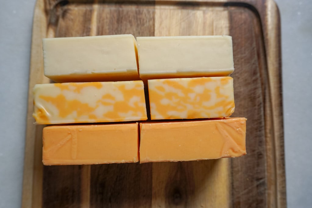 blocks of colby jack, monterey jack, and sharp cheddar cheese