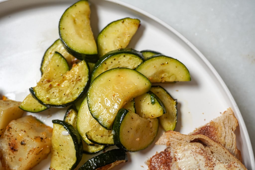 close up view of air fryer zucchini on a plate