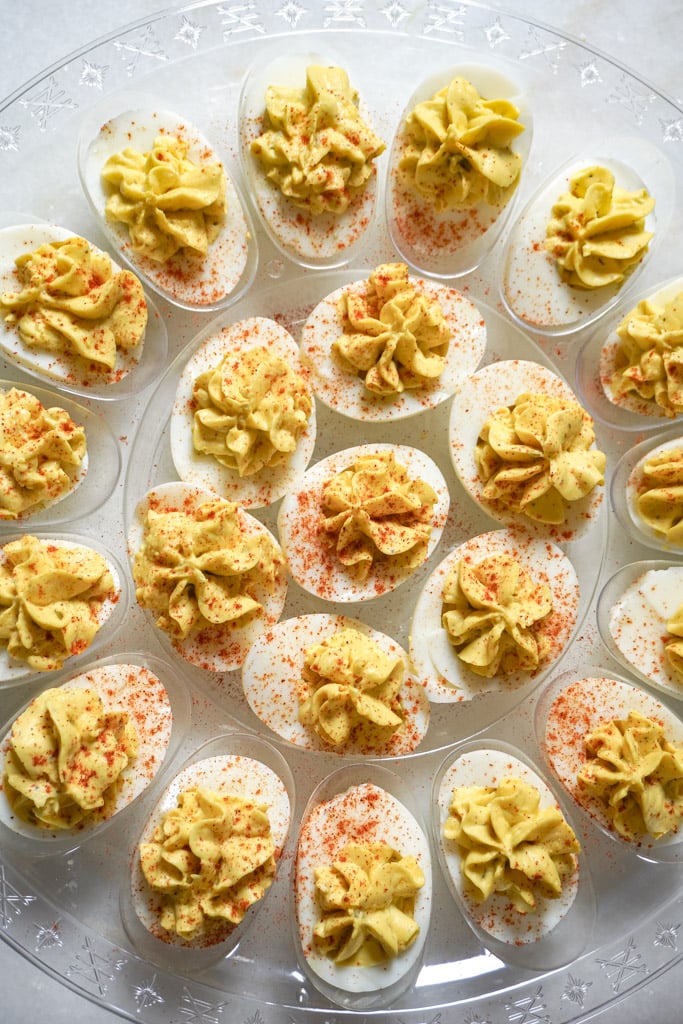 a platter of the nesy deviled eggs recipe, topped with paprika