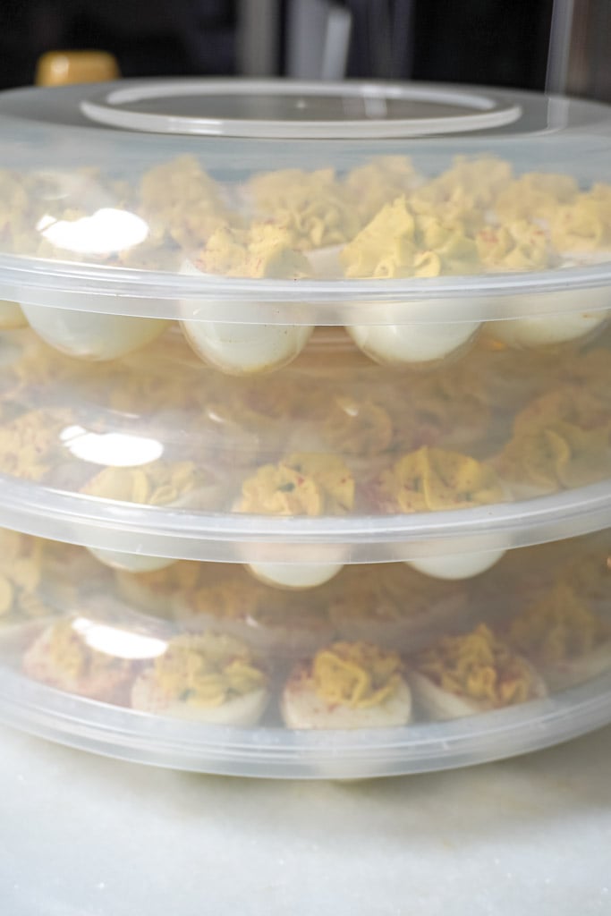 stacked deviled eggs in a portable container