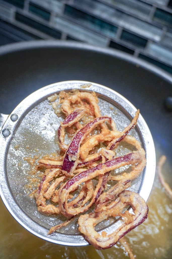 french fried onions frying in a pan and nearly done