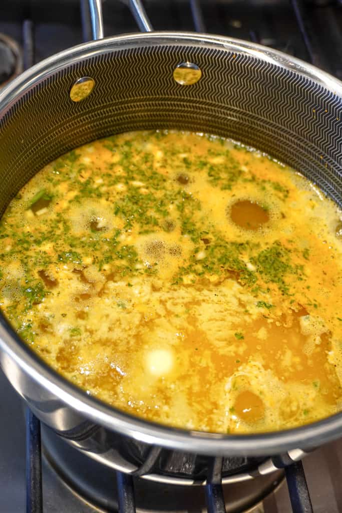 a pot of yellow rice simmering