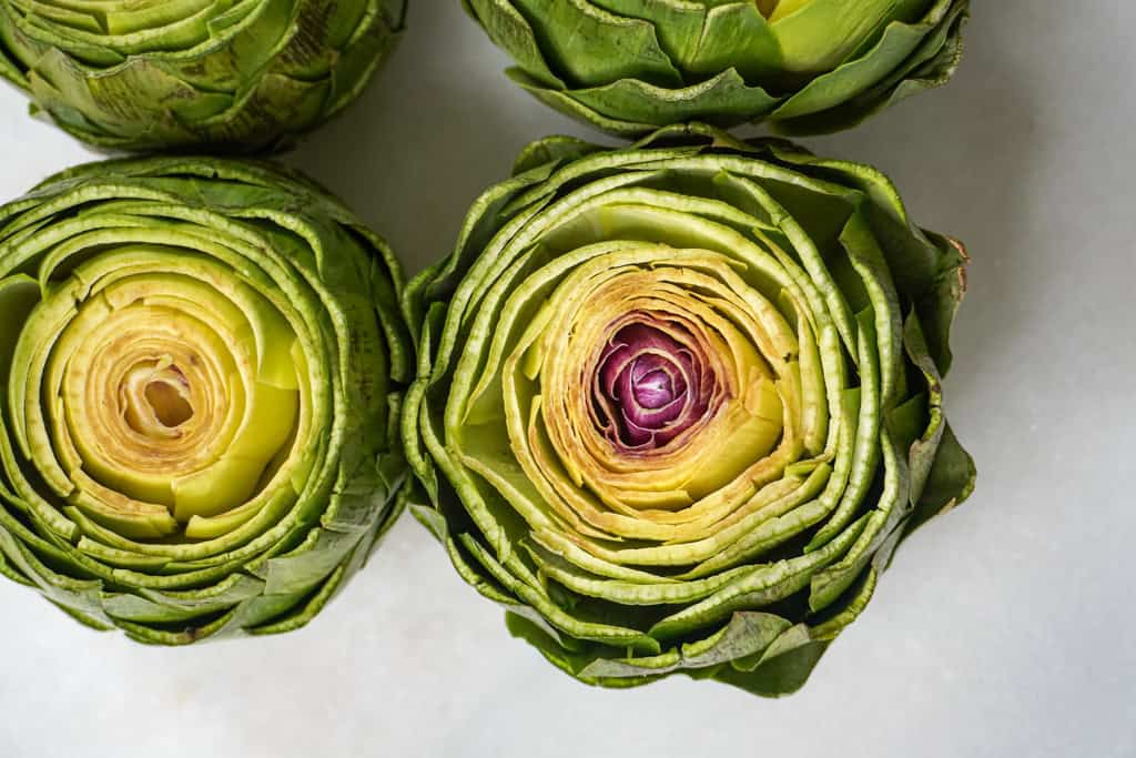 close up view of raw artichokes