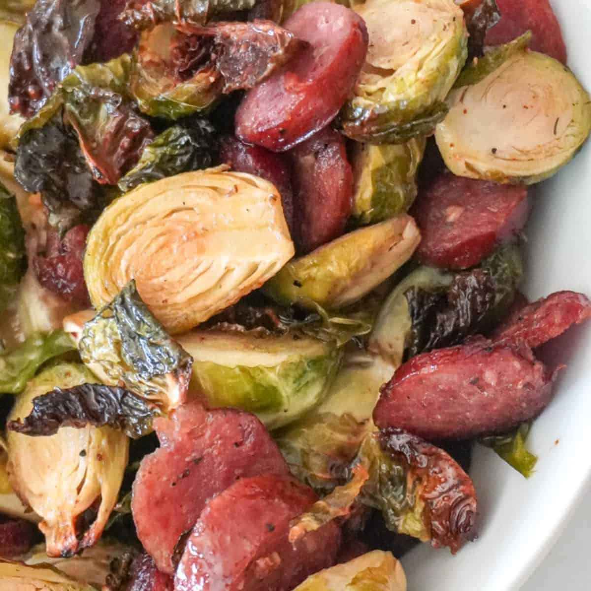 close up view of air fryer brussel sprouts with sausage