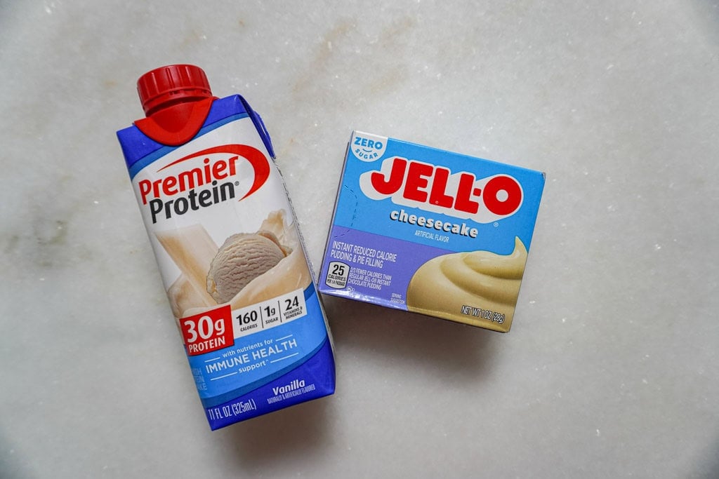 a carton of protein drink and a box of cheesecake Jello