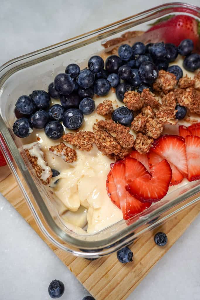 a casserole dish of protein pudding with a spoonful missing