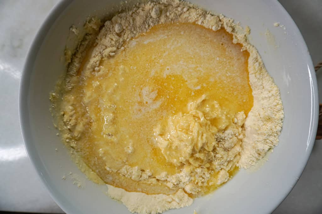 Cake mix and buttermilk in a bowl, ready to be mixed.