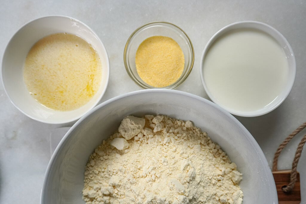 Flat lay of cobbler ingredients in separate bowls.