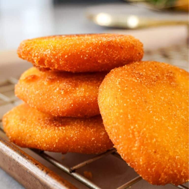 stacked hot water cornbread on a cooling rack