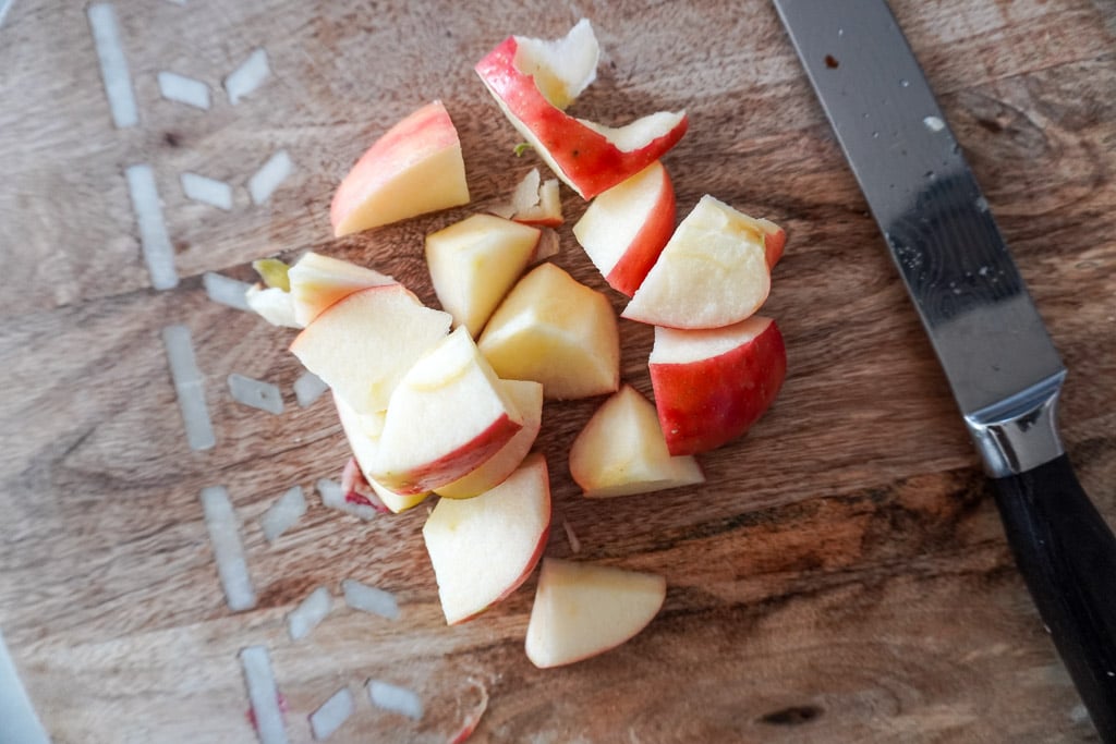cubed up apples on a cutting board