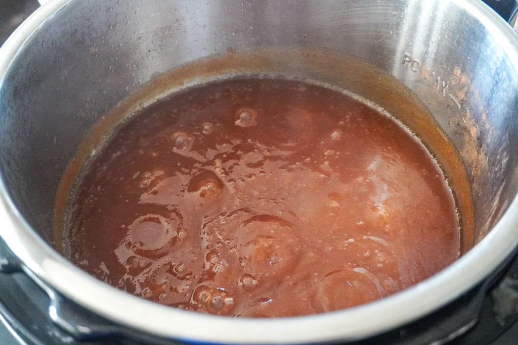 apple butter simmering in a pot