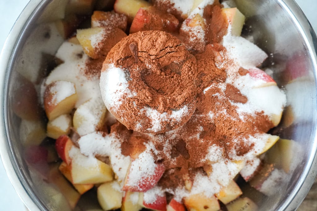 apples in the instant pot with spices and sugar for apple butter