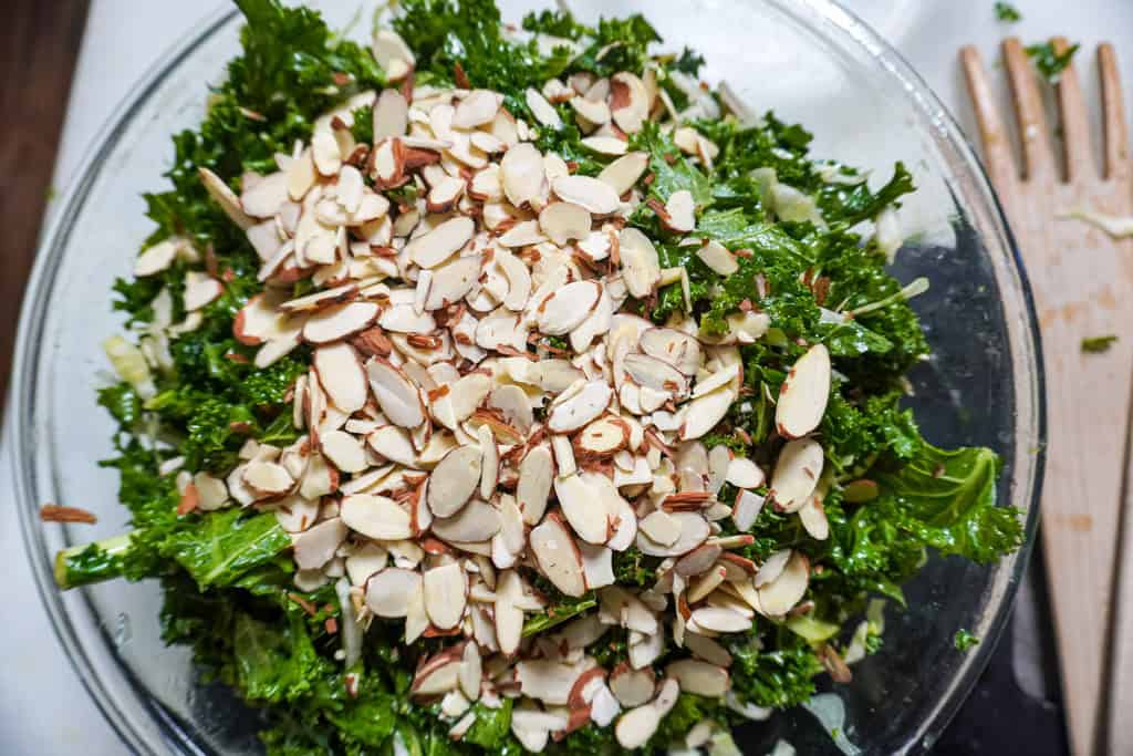 slivered almonds on a kale salad