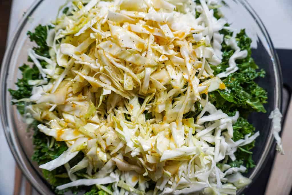 shaved cabbage mixed with a kale salad