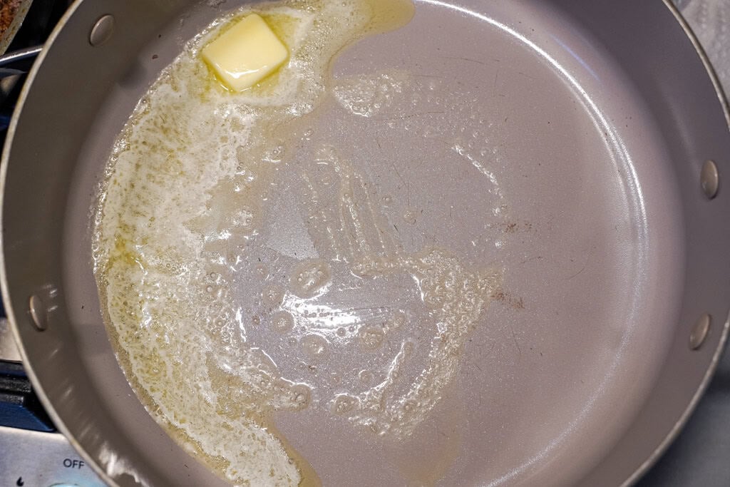 melting butter in a skillet for nacho cheese sauce