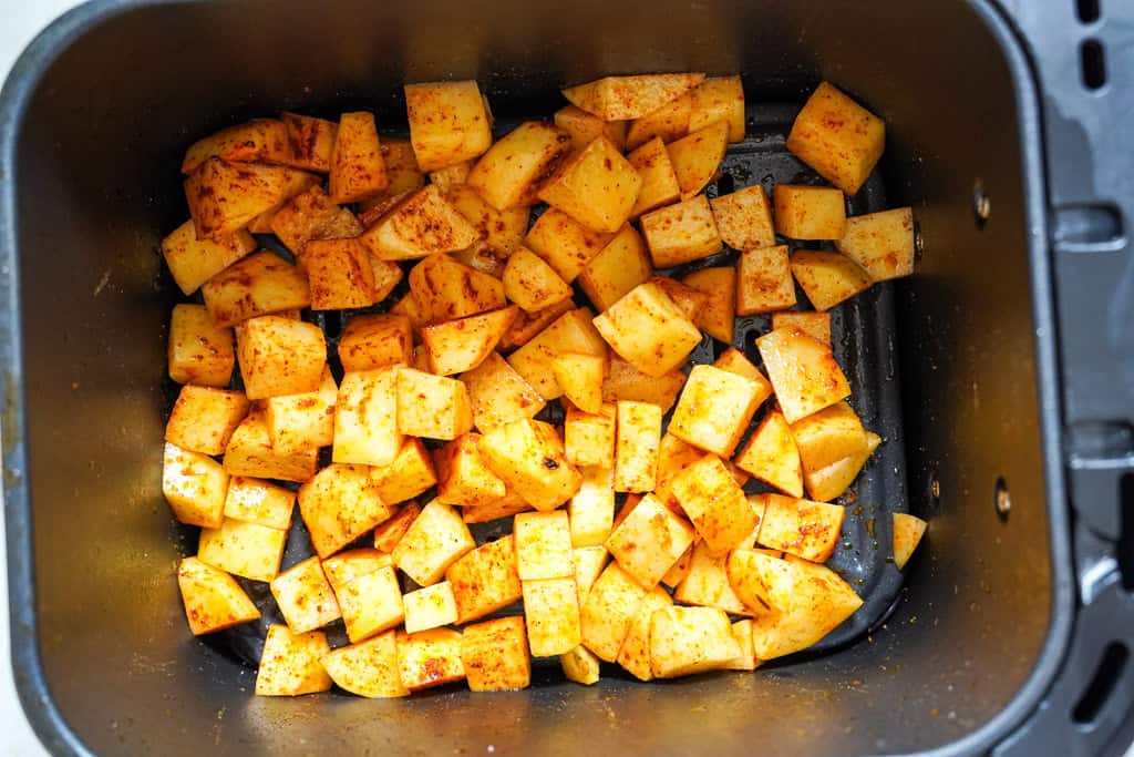 cheesy fiesta potatoes cooking in the air fryer