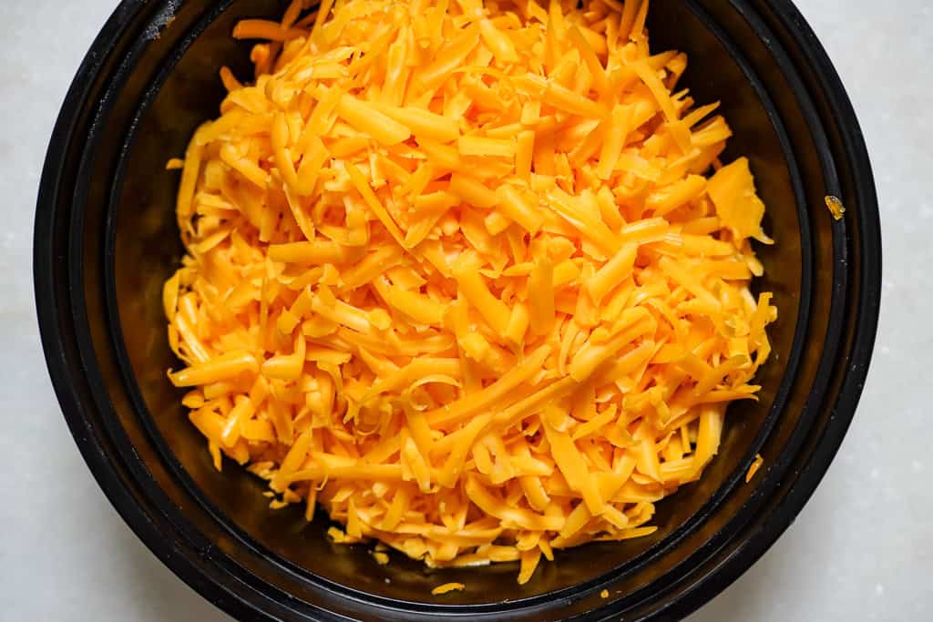 shredded cheddar cheese in a bowl