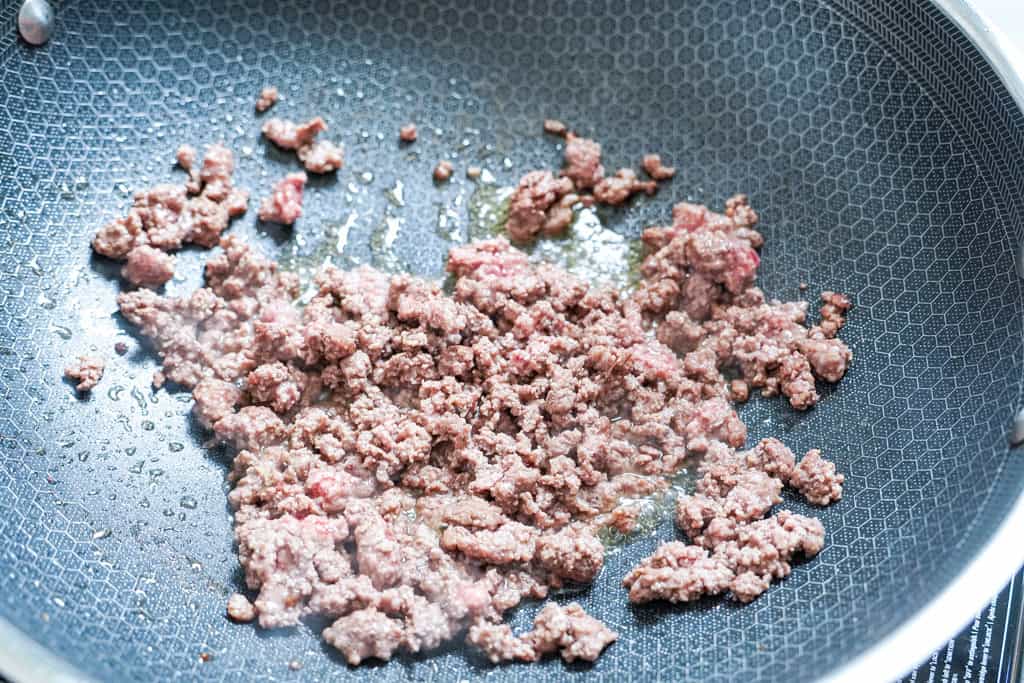 ground beef in a skillet for dirty rice recipe