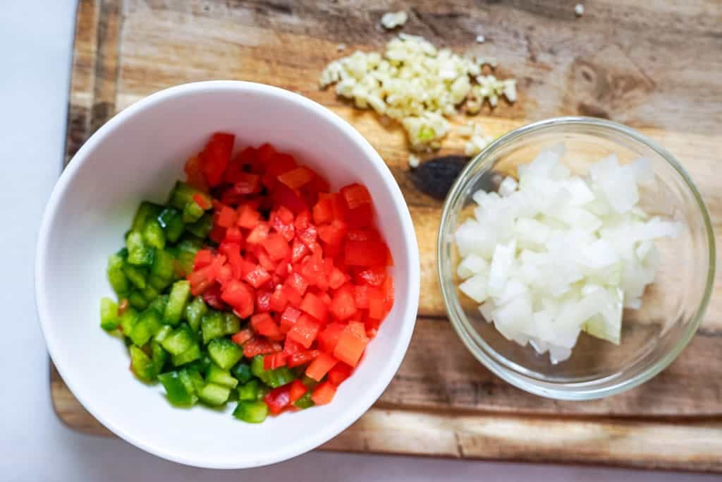 chopped onions and peppers in a bowl