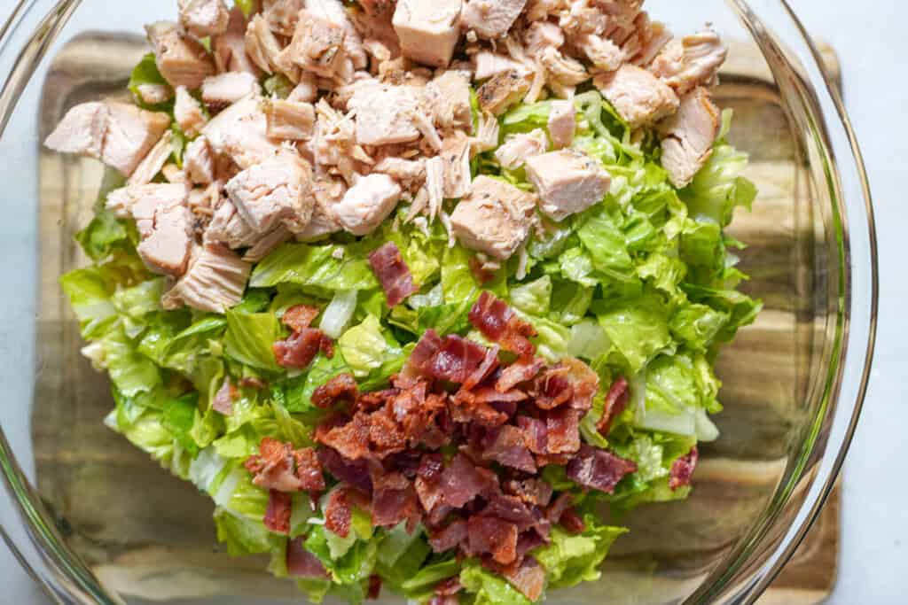 creamy chicken caesar pasta salad in a bowl