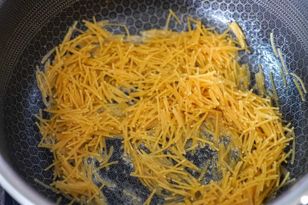 toasting rice pilaf in a skillet