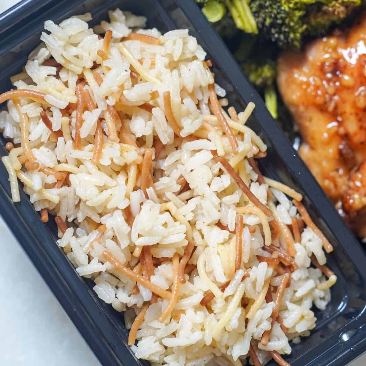 rice pilaf, chicken and broccoli in a meal prep bowl