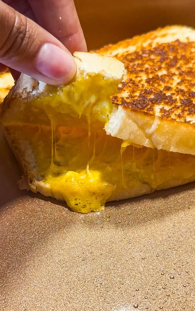 making a grilled cheese sandwich with homemade bread